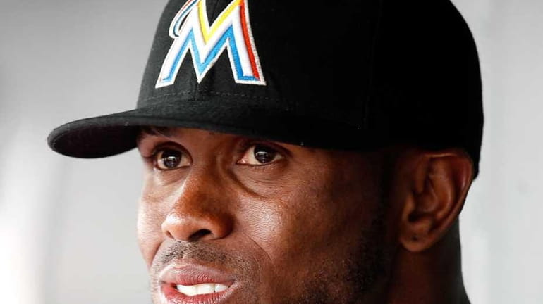 Jose Reyes of the Miami Marlins looks on from the...