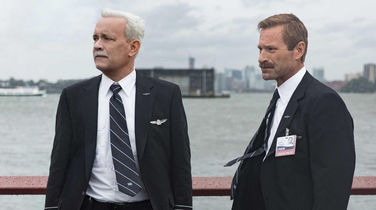 Tom Hanks as Chesley "Sully" Sullenberger, left, and Aaron Eckhart...