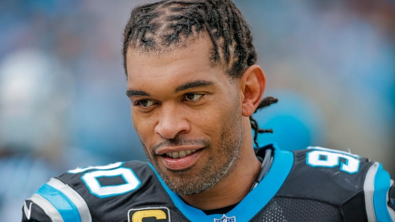Carolina Panthers' Julius Peppers looks on from the sidelines during...