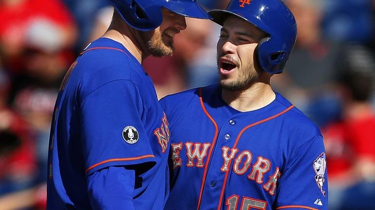 Lucas Duda of the Mets is congratulated by Travis d'Arnaud...