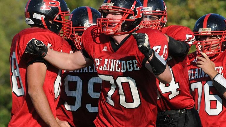 Plainedge No. 70 Steve McCartney reacts after recording a sack...