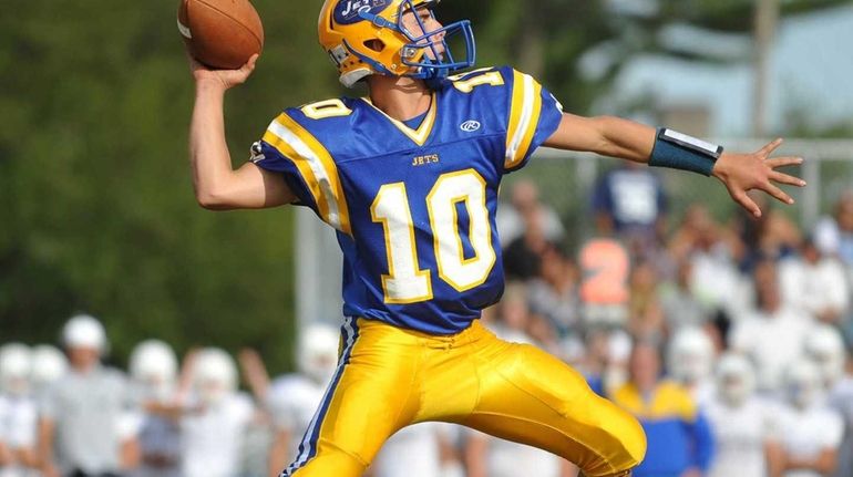 East Meadow's Anthony LaRosa throws a pass for a 43-yard...