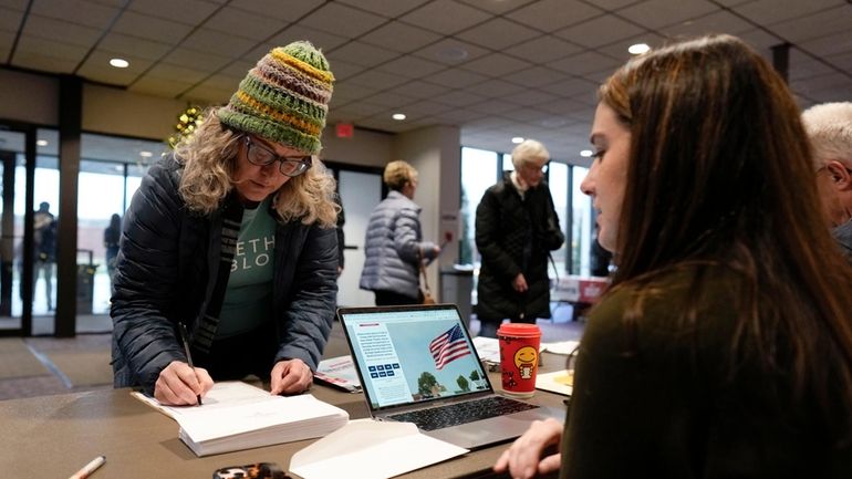 An audience member arrives at U.S. Rep. Randy Feenstra's, R-Iowa,...