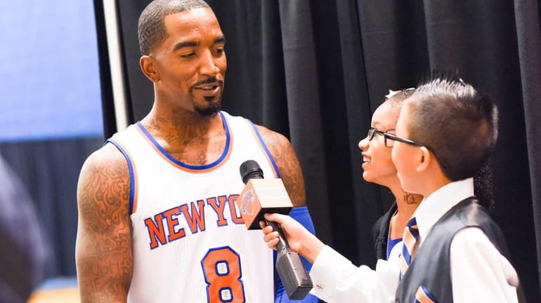 Knicks guard J.R. Smith (8) speaks to a reporter during...