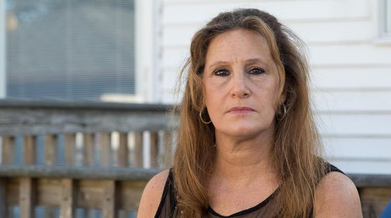 Job hunter Marie Santora-Lent poses for a portrait at her home...