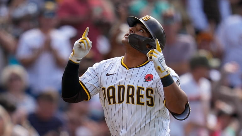 San Diego Padres' Donovan Solano celebrates after hitting a home...