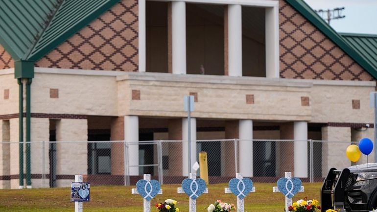 A memorial is seen at Apalachee High School after the...