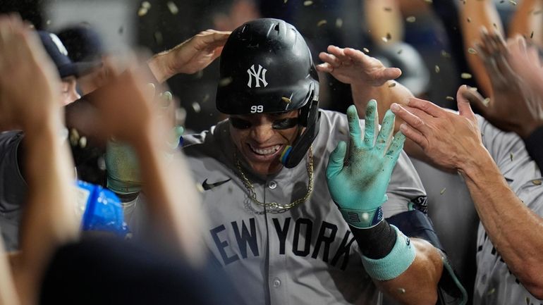  Yankees designated hitter Aaron Judge celebrates after hitting his 300th...