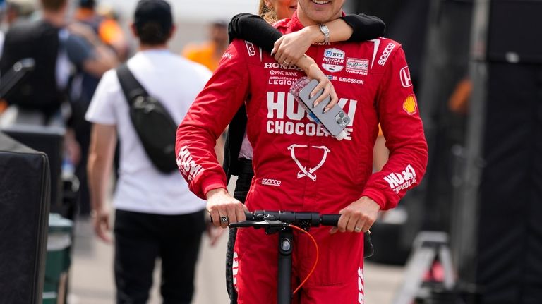 Marcus Ericsson, of Sweden, rides out of the pit area...