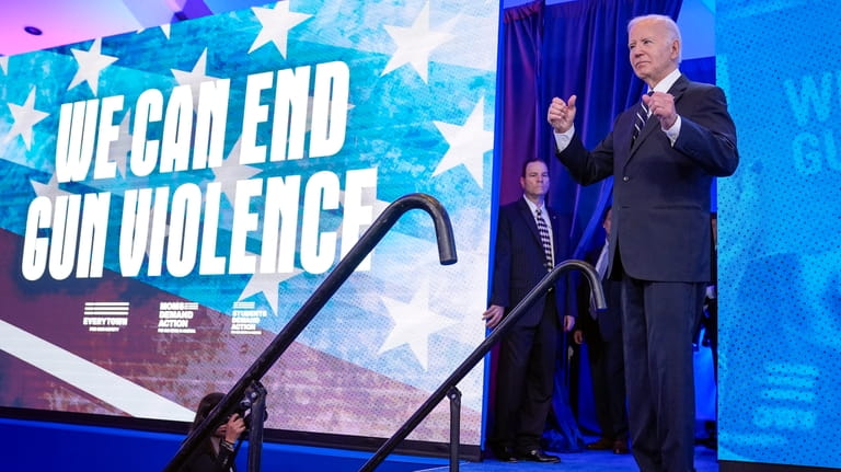 President Joe Biden gestures after speaking to Everytown for Gun...