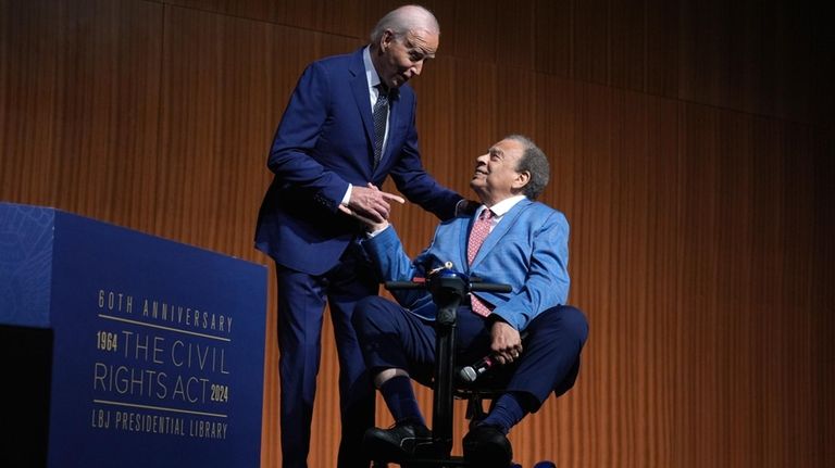 President Joe Biden, left, and civil rights activist Andrew Young...