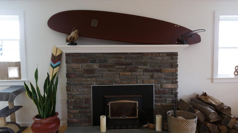 Surfboards decorate Infernuso's house, inside and out.