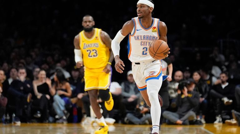 Oklahoma City Thunder guard Shai Gilgeous-Alexander (2) dribbles during the...