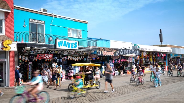 Small businesses line the boardwalk in Wildwood, N.J., on Aug....