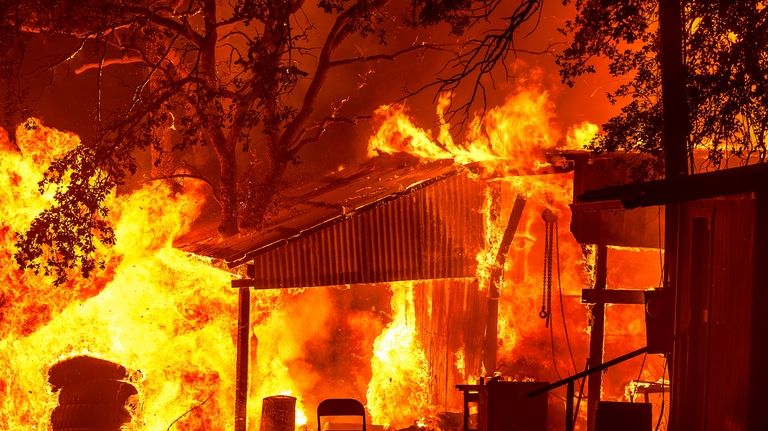 Flames consume structures as the Park Fire burns in Tehama...