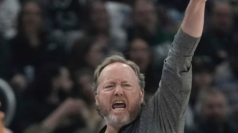 Milwaukee Bucks head coach Mike Budenholzer reacts during the first...