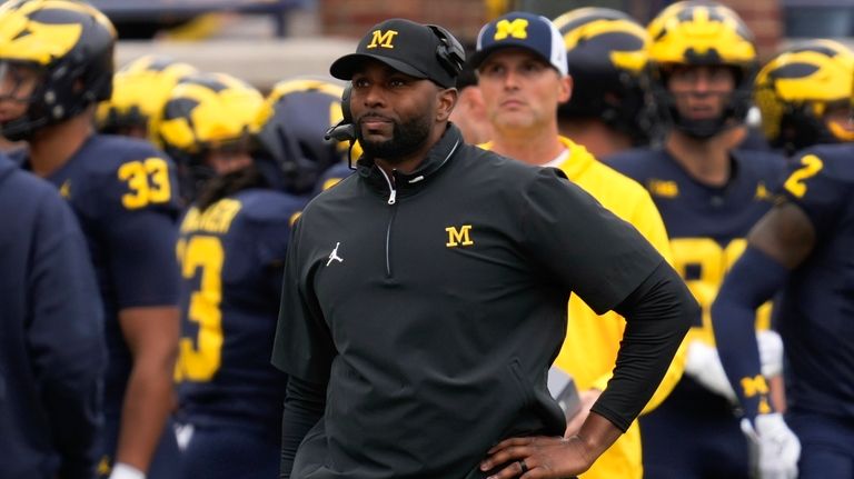 Michigan head coach Sherrone Moore watches against Texas in the...