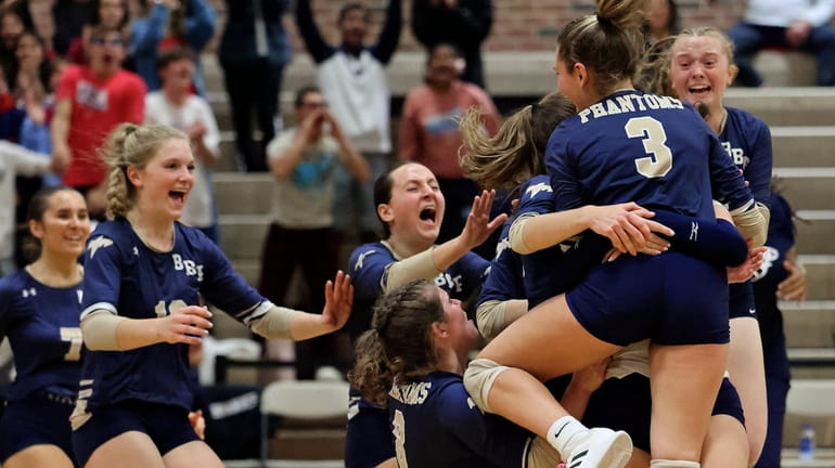 Bayport-Blue Point celebrates its win against Hampton Bays in the...