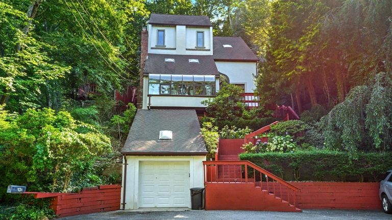 This $799,000 Northport home has a manmade rock waterfall.