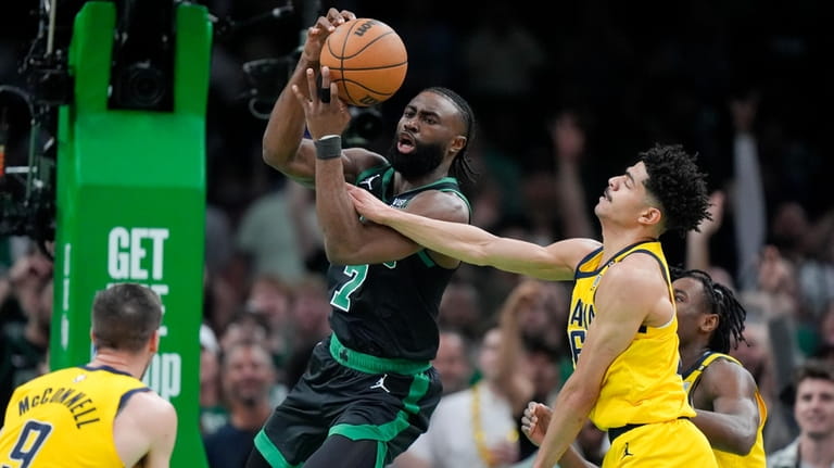 Boston Celtics guard Jaylen Brown (7) grabs a rebound next...