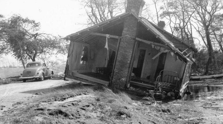 This house on Dune Road was washed inland, onto the...