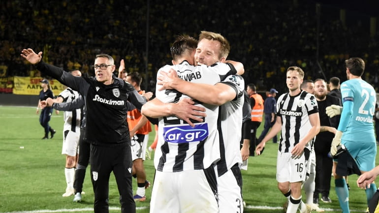 PAOK's players celebrate winning the Greek Super League soccer championship...