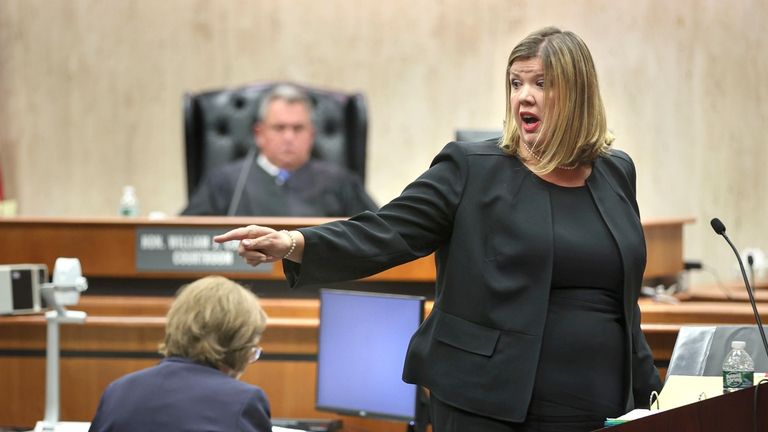 Suffolk Assistant District Attorney Laura Newcombe points to the defendant,...