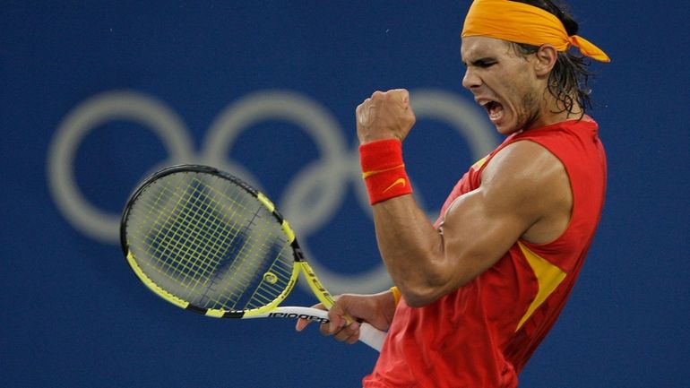 Rafael Nadal of Spain reacts to winning a point against...