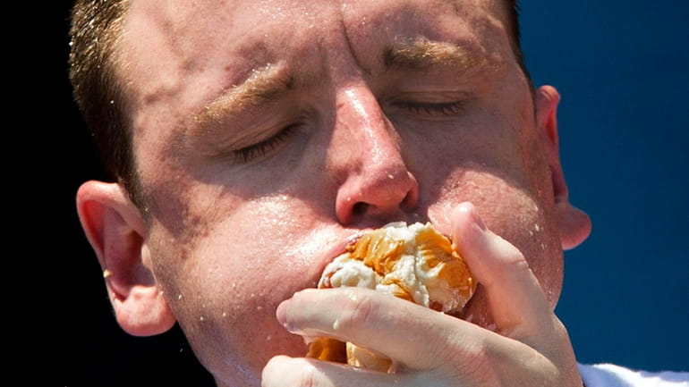 Five-time reigning champion Joey Chestnut competes in the Nathan's Famous...