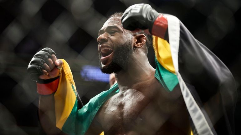 Aljamain Sterling celebrates after his UFC bantamweight championship fight against...