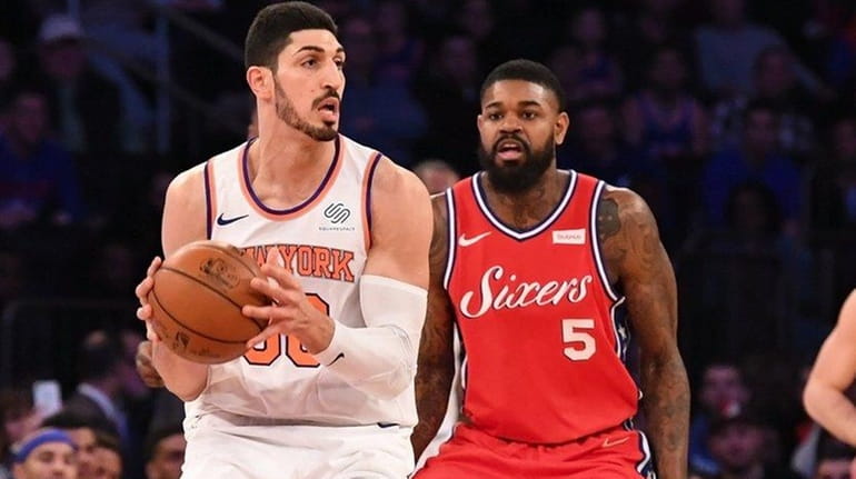 Enes Kanter of the Knicks is guarded by Amir Johnson...