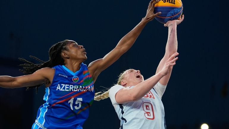 Azerbaijan's Tiffany Hayes defends against a shot by Hailey van...