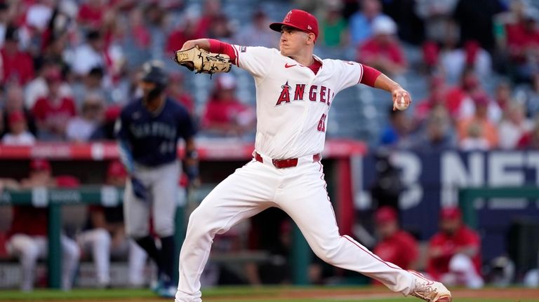 Los Angeles Angels starting pitcher Samuel Aldegheri throws to the...