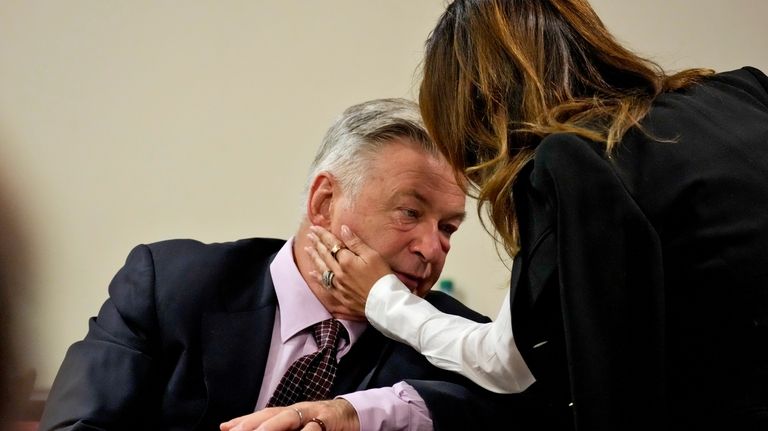 Actor Alec Baldwin interacts with his wife Hilaria Baldwin during...