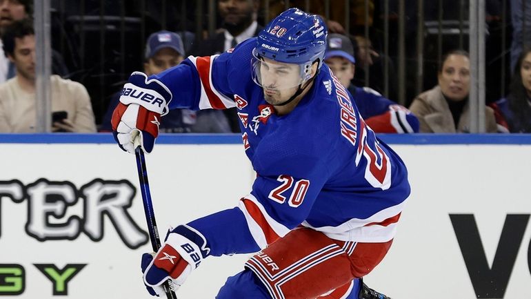 Chris Kreider of the Rangers shoots the puck during the third period...