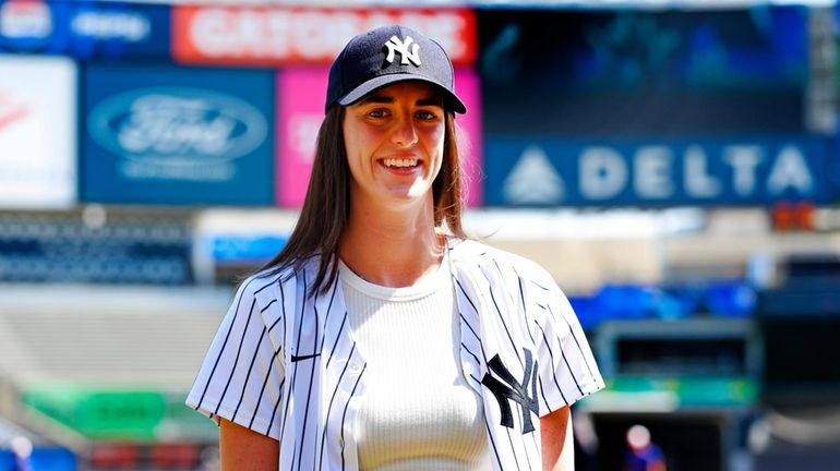 WNBA player Caitlin Clark is photographed before a doubleheader game...