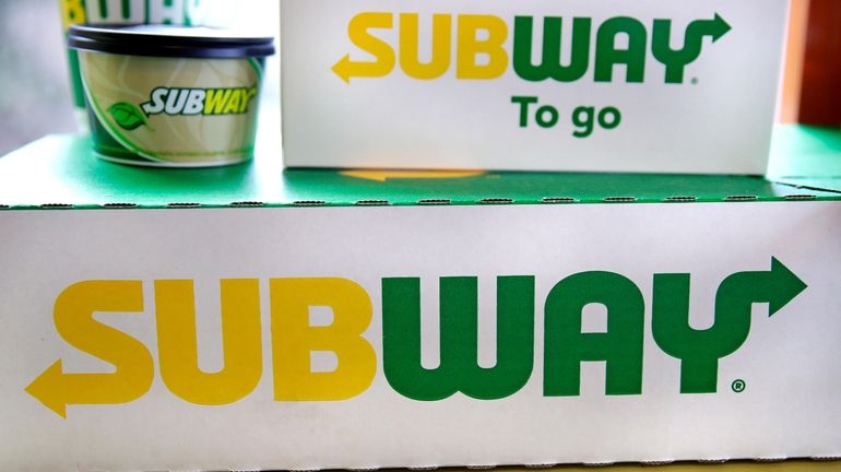 File - The Subway logo is seen on takeout boxes...