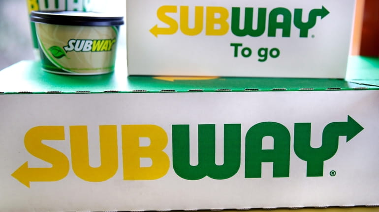 File - The Subway logo is seen on takeout boxes...