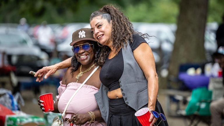 Friends Mary Payton Coward, left, and Sandra Torres have fun during the annual...