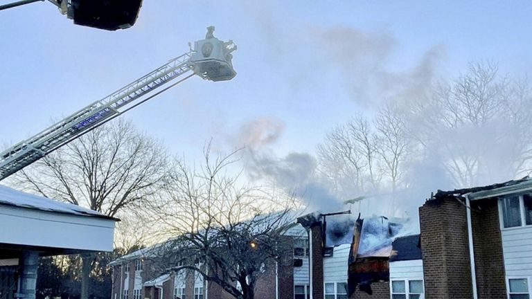 Firefighters on Sunday morning work to extinguish the fire at a...