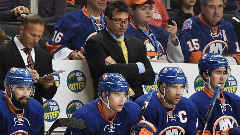 New York Islanders head coach Jack Capuano looks on against...