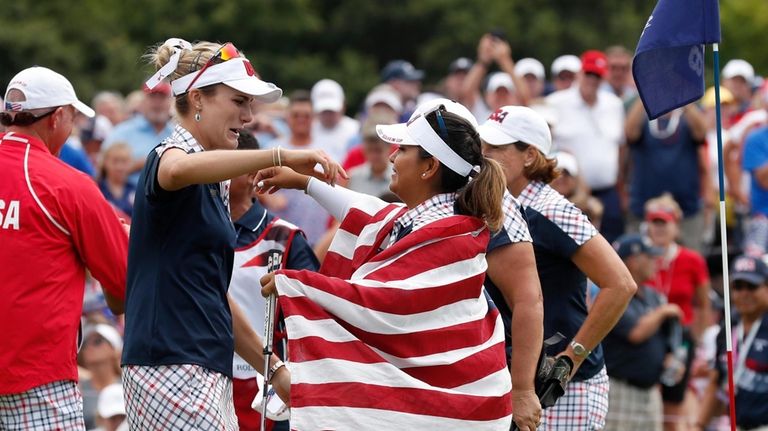 United States' Lizette Salas celebrates with teammate United States' Lexi...