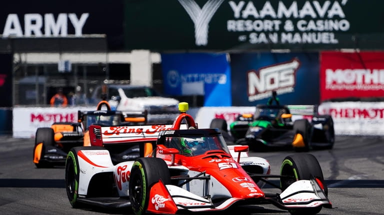 Dale Coyne Racing driver Nolan Siegel, front, leads Arrow McLaren...