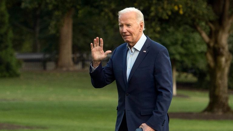 President Joe Biden arrives at the White House in Washington,...