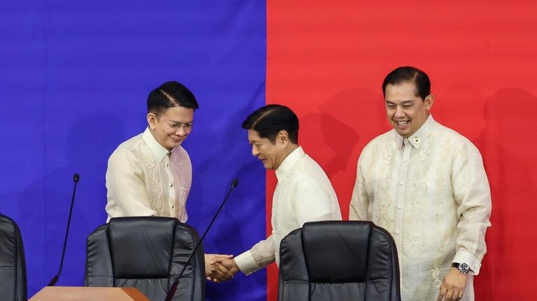 Philippines President Ferdinand Marcos Jr. center, shakes hands with Senate...