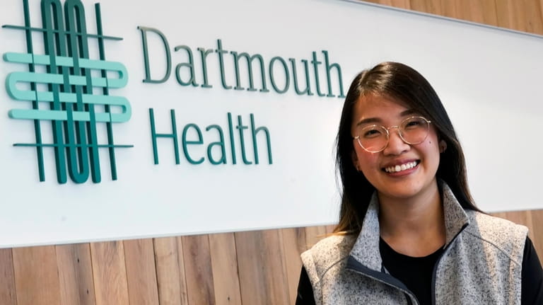 Andy Hoang, a recent nursing graduate, poses at the Dartmouth-Hitchcock...