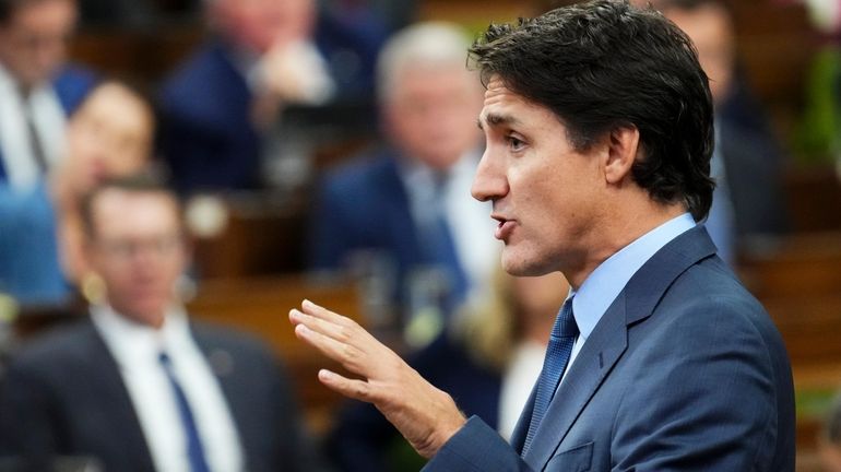 Prime Minister Justin Trudeau answers a question during question period...