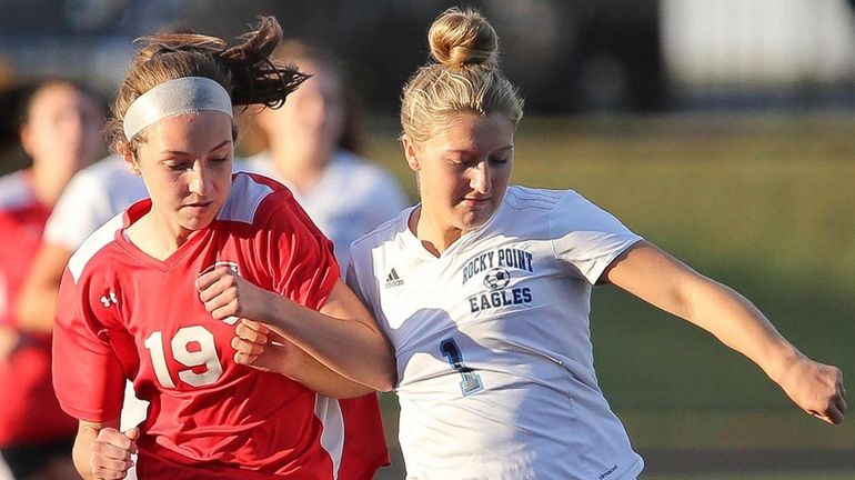 Rocky Point's Gianna Amendola and East Islip's Krista Deutsch play the...