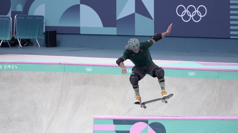 South Africa's Dallas Oberholzer performs, during a men's skateboard park...