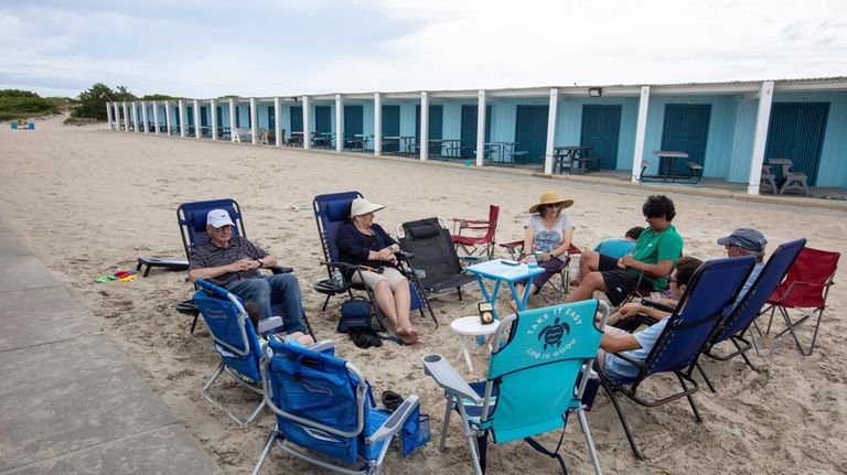 The Mazzarella family, of Wantagh, relax outside their cabana at...